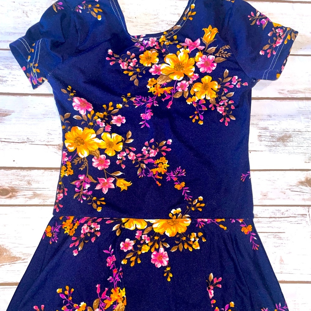 Facebook small shop called Macy Kate Boutique. Navy floral skirted Leo